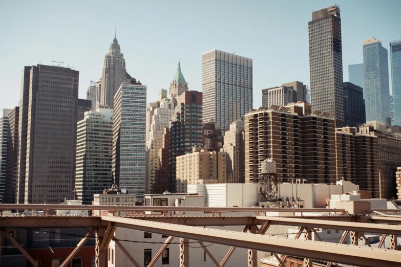 a large city skyline is shown from across the river