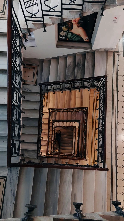 a stairwell view from a high floor in a residential building