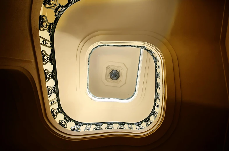 an airy looking ceiling with white walls and patterns