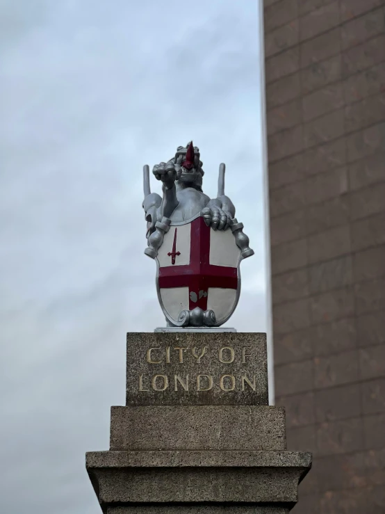 a coat of arms is displayed on the top of a building