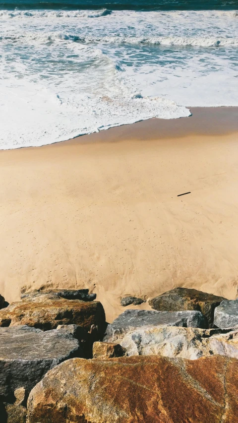 an ocean view of a beach near water