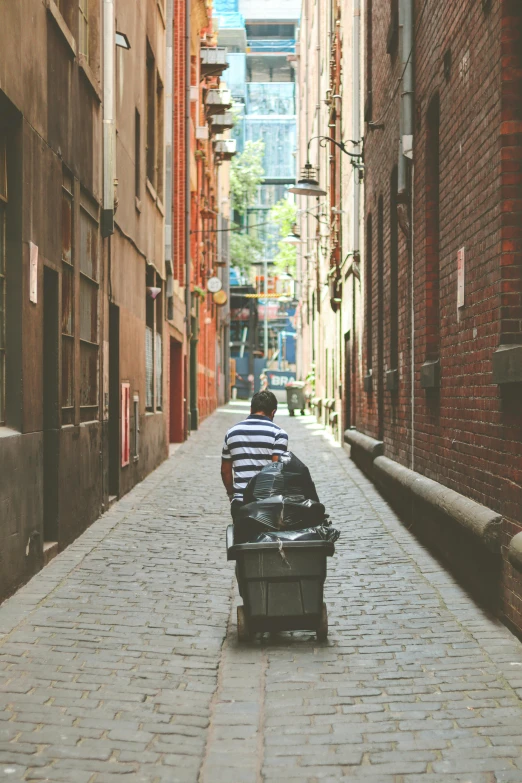 there is a man walking on a city street