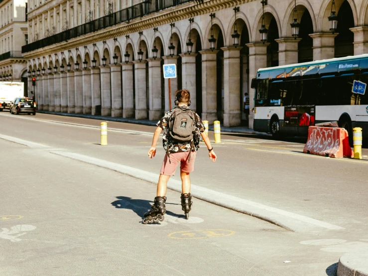 a woman on roller blades walks down the street