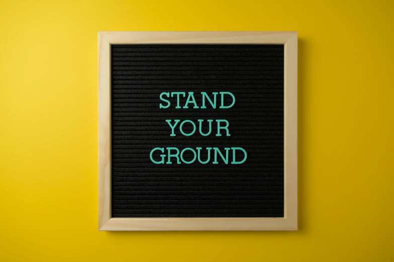 a picture of a board saying stand your ground