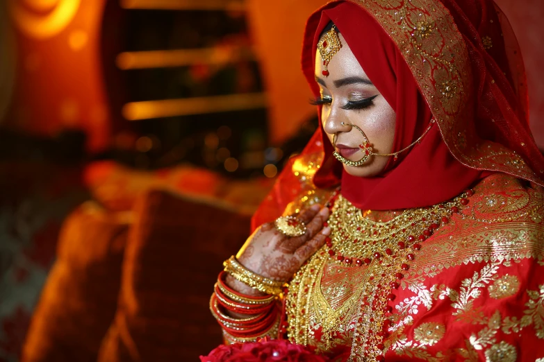 a woman wearing a red and gold outfit