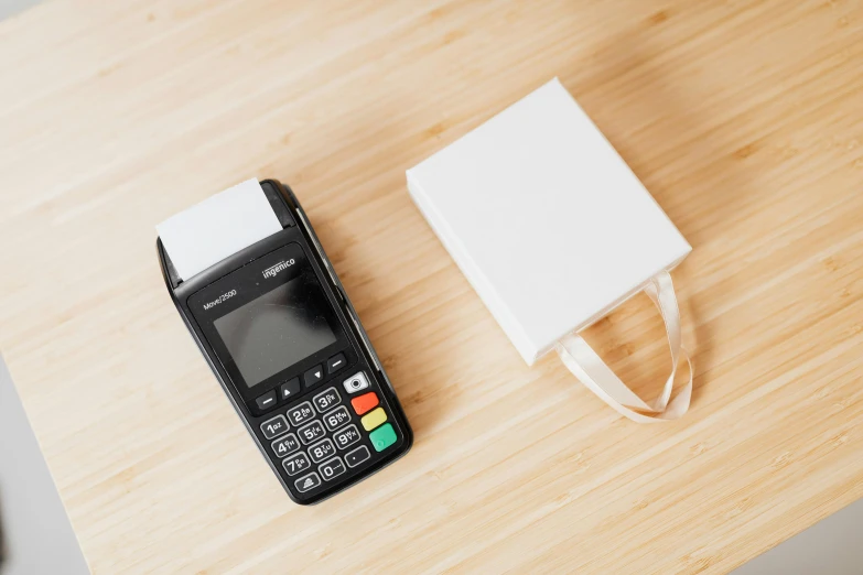 a cell phone and an ipad on a table