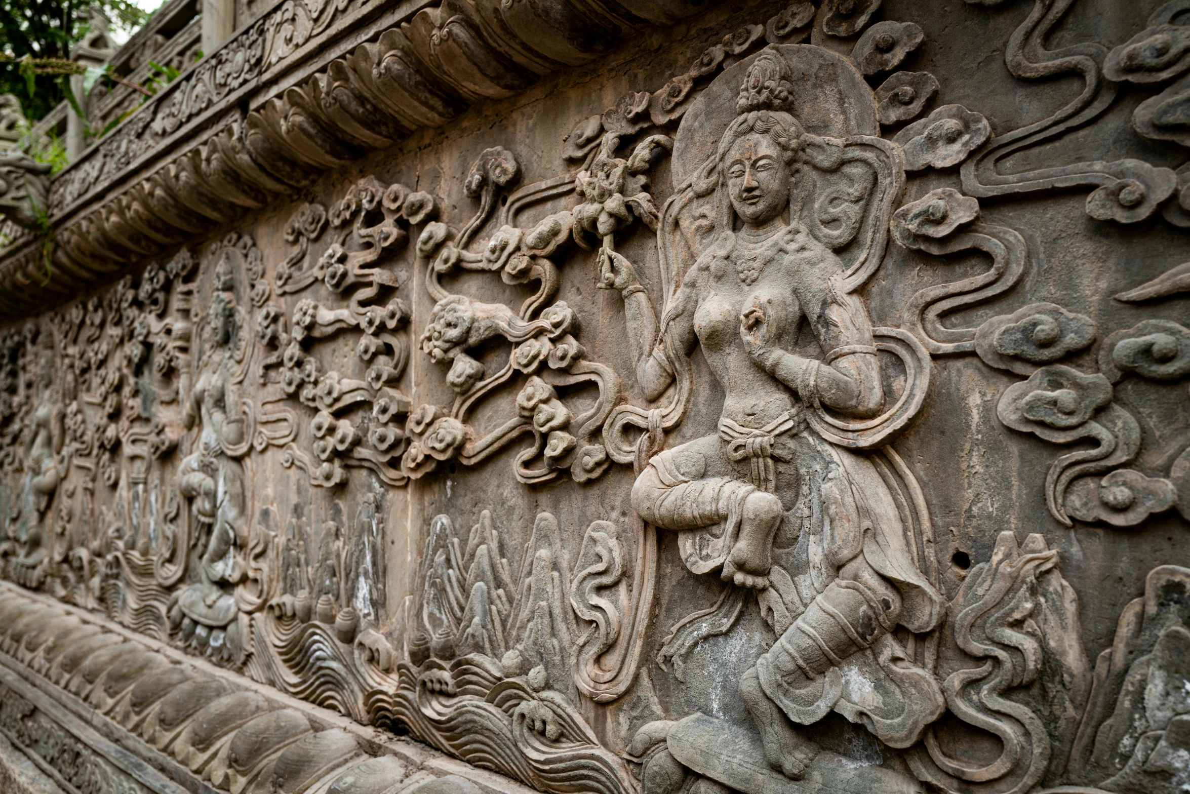 carved carvings on a stone structure in a temple