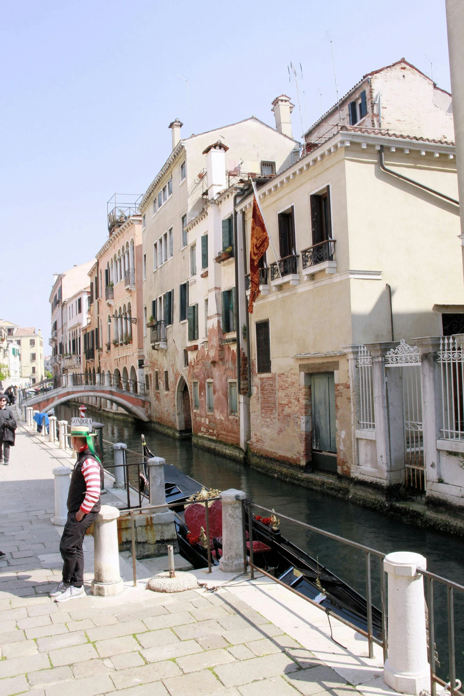 some people are standing on the edge of a waterway