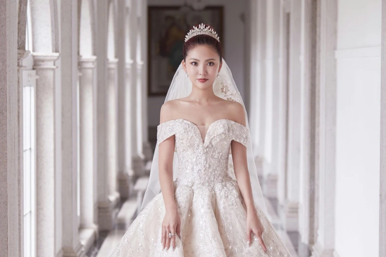 the woman in the white dress has a wedding veil on