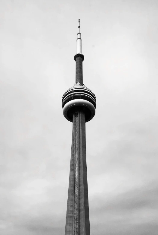 the sky tower stands tall and empty against the gray skies