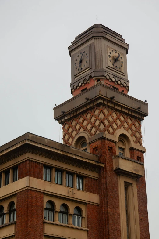 a clock tower with three clocks on the top