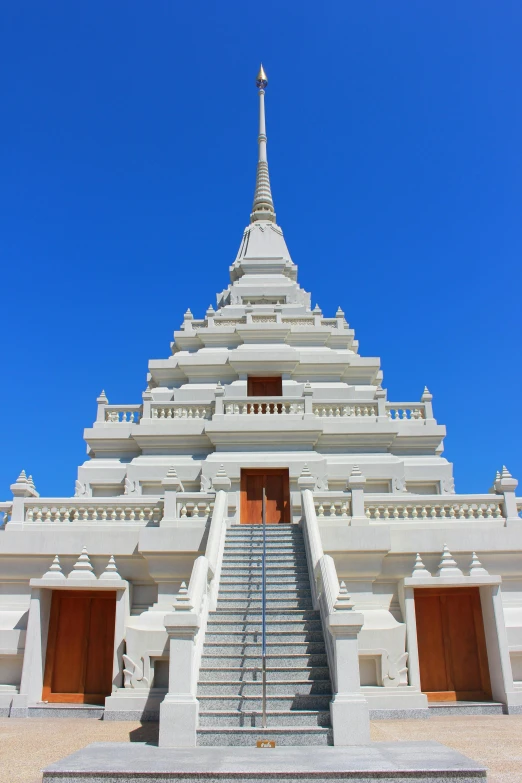 a view of some stairs in front of a white building