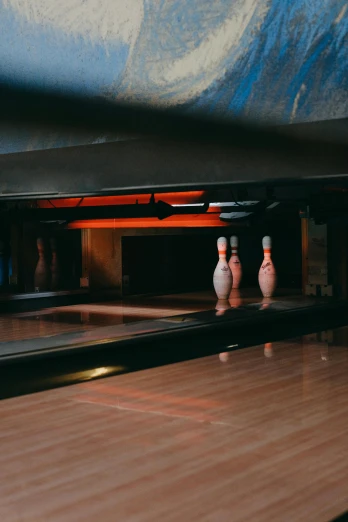 bowling balls near the end of a bowling alley