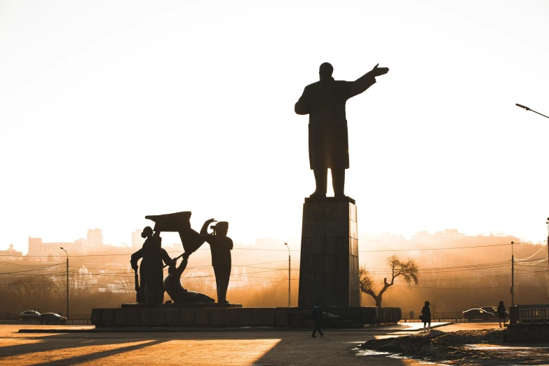 there is a statue with two people sitting on top of it