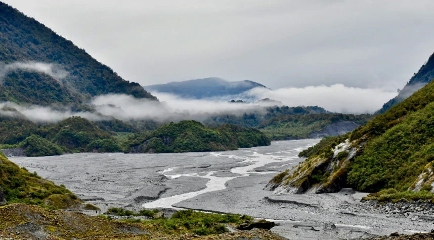 a valley that is very steep and surrounded by mountains