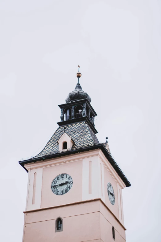 a tall white building with a clock tower at the top