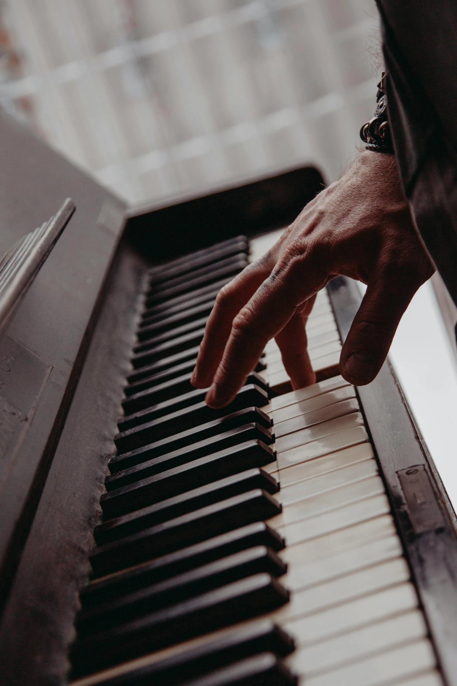 a man playing the piano with his hands