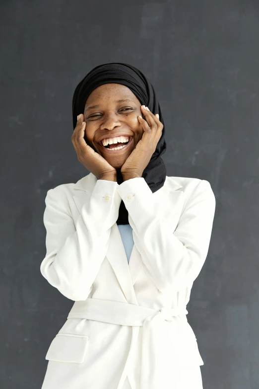 a person that is smiling wearing a tie