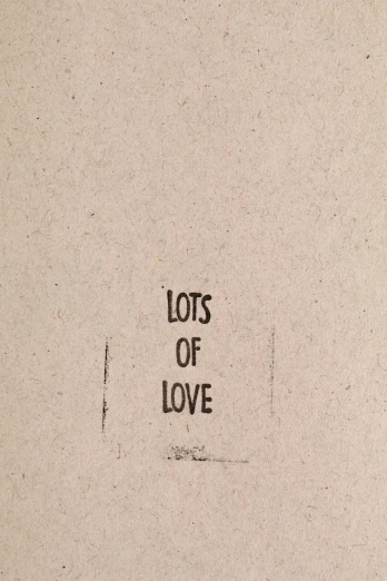 a piece of cardboard has words on it that read lots of love