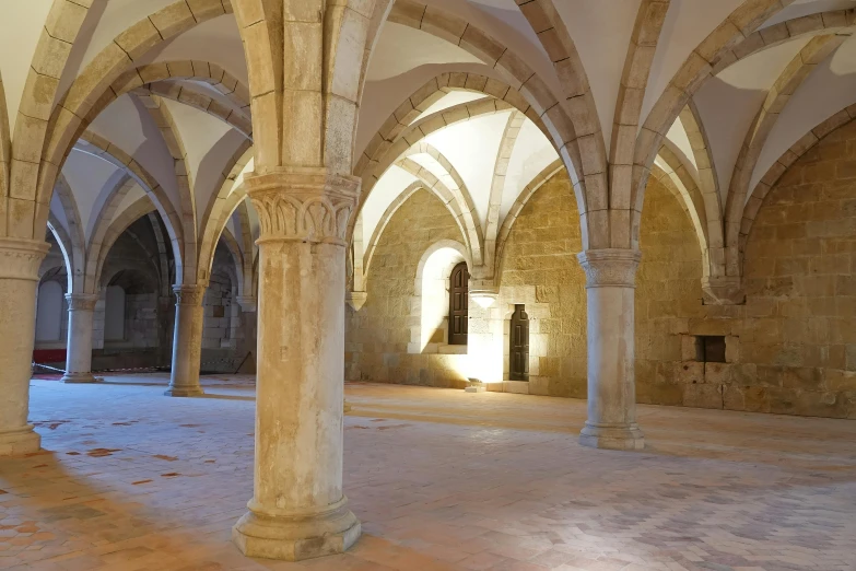 the large arches and pillars are made of stone