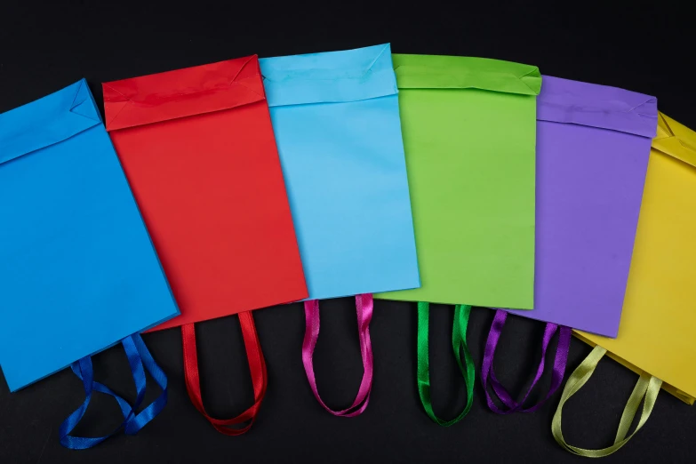 multi colored bags in an arrangement on black background