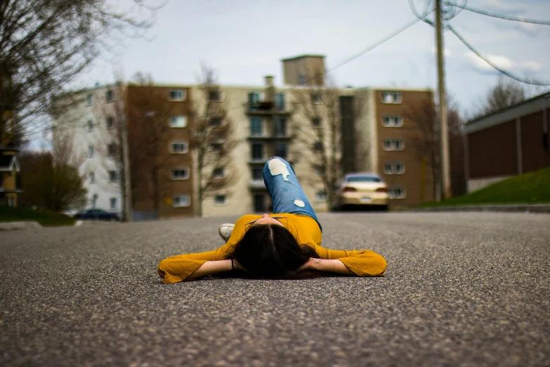 a woman that is laying on the ground