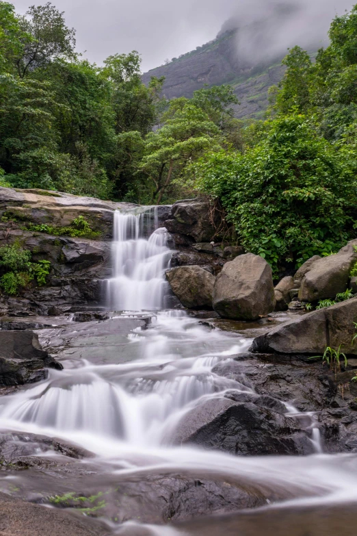 waterfalls with clear water in a tropical setting