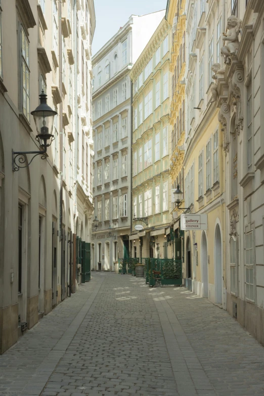 an empty city street has lots of buildings on it