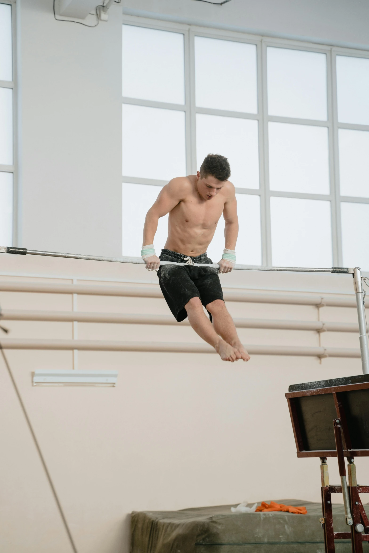 a man in a high jump between two buildings