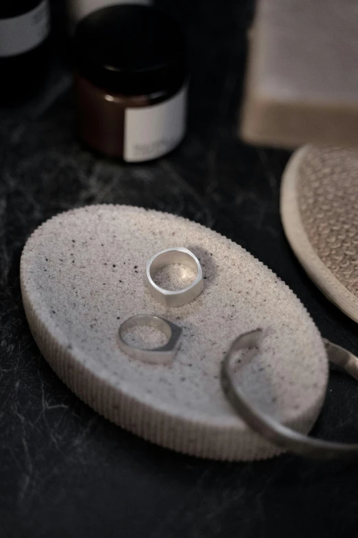 a pair of scissors and two plates on a counter