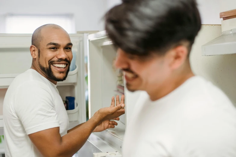 there is a man smiling while looking at himself in the mirror