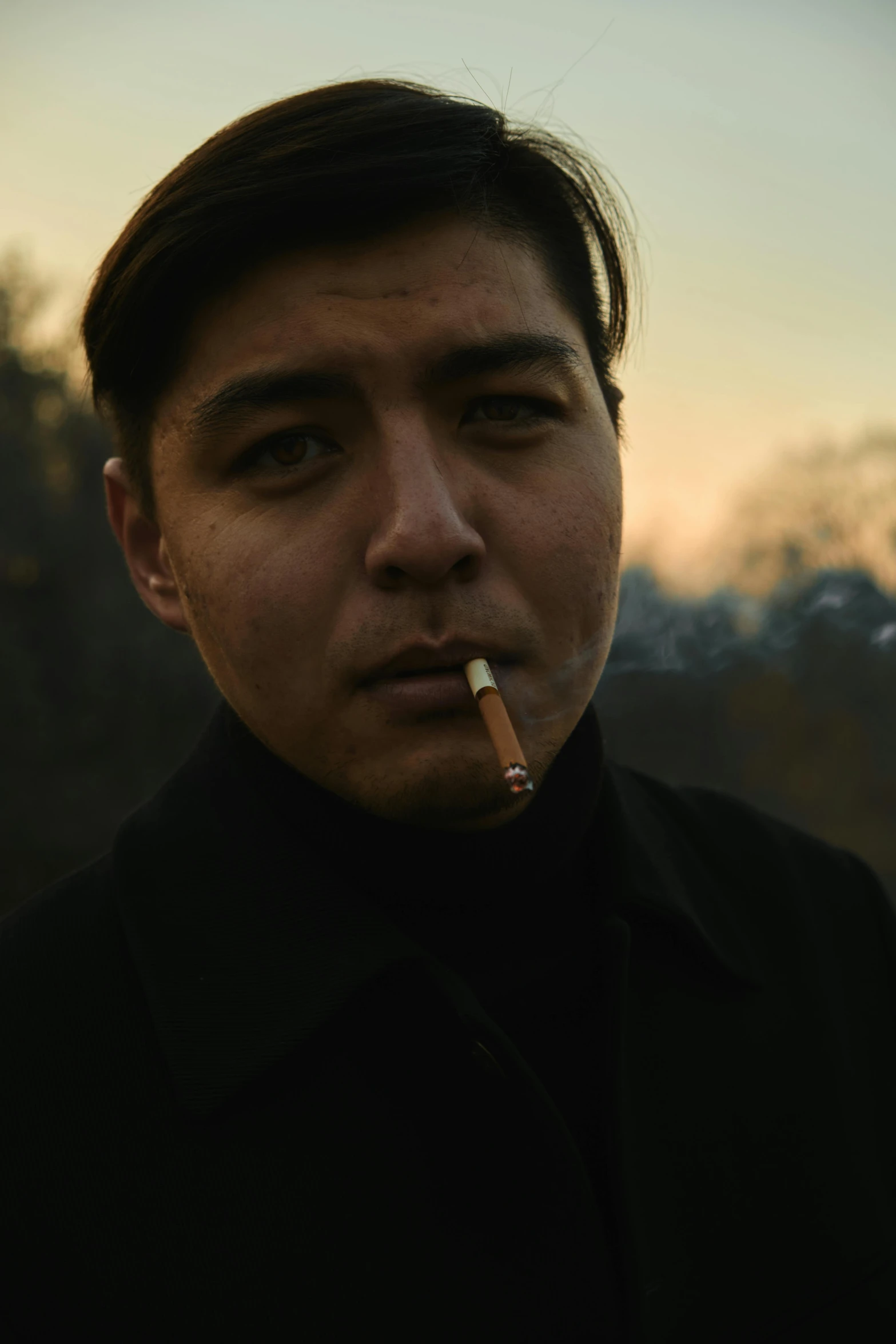 a man with a cigarette in his mouth