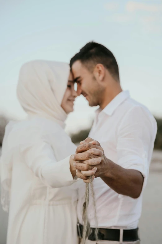 an older couple are holding hands and smiling