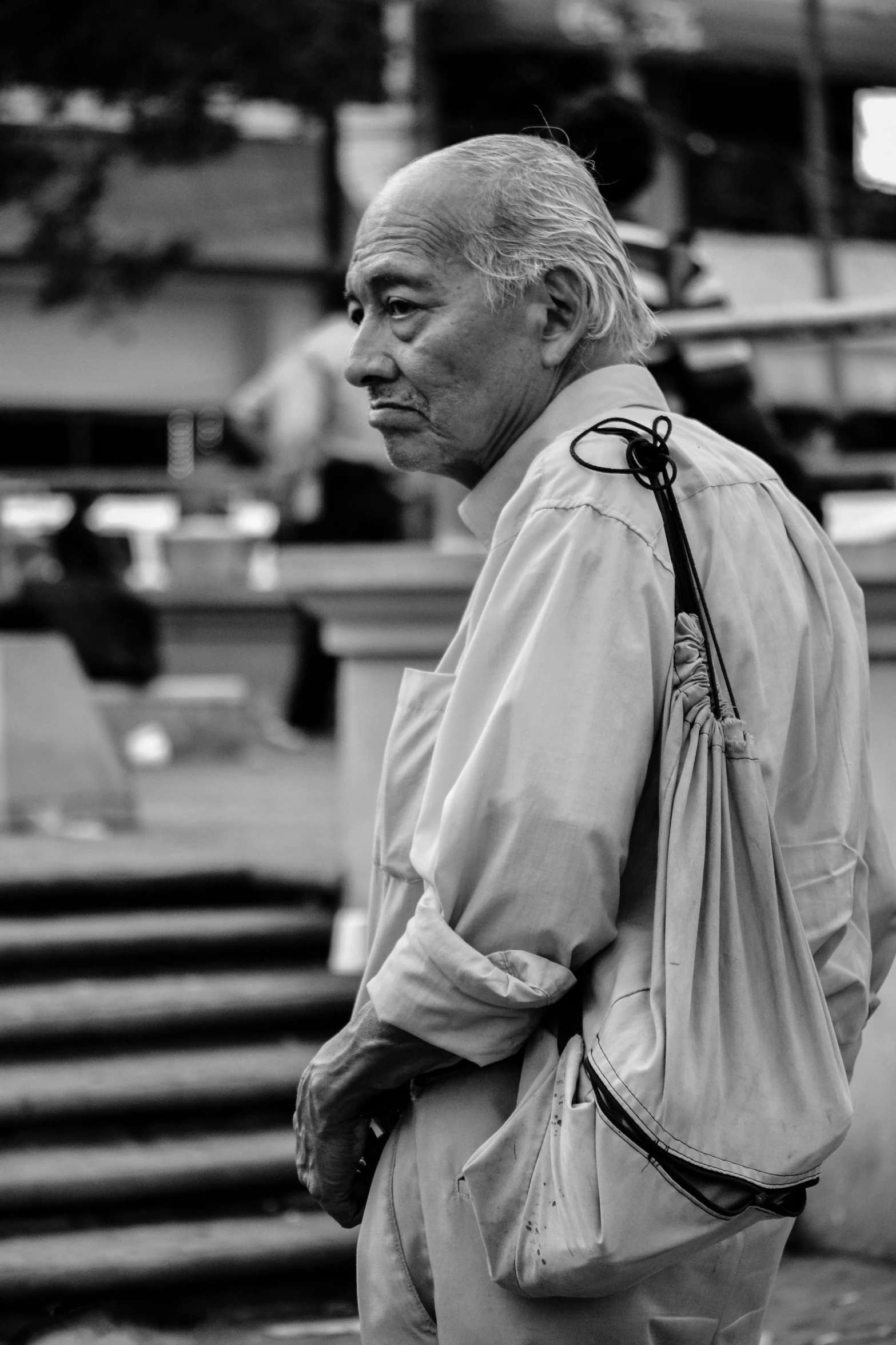 a person in a dress shirt with his hands on his hips