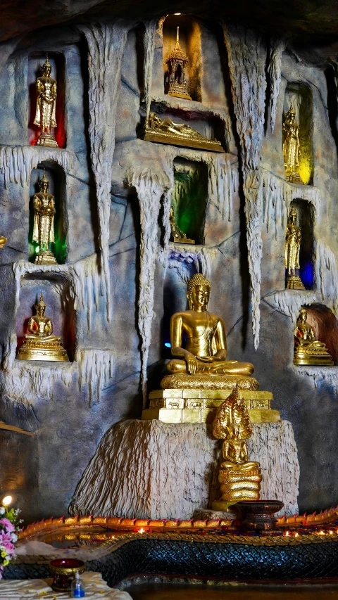 a room decorated with gold and green and blue decorations