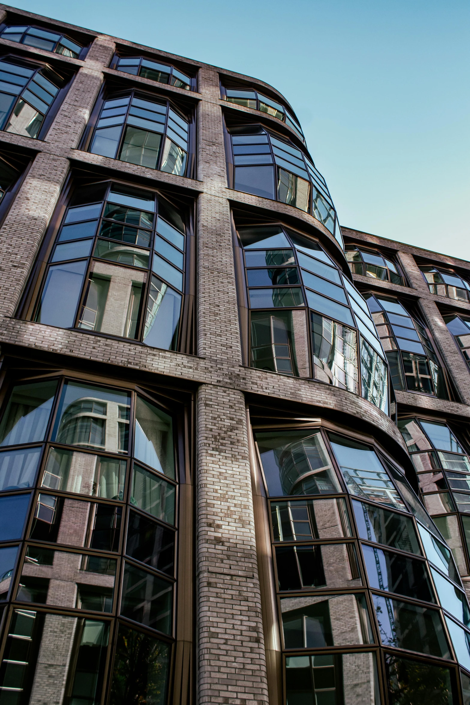 a building with lots of windows near the street