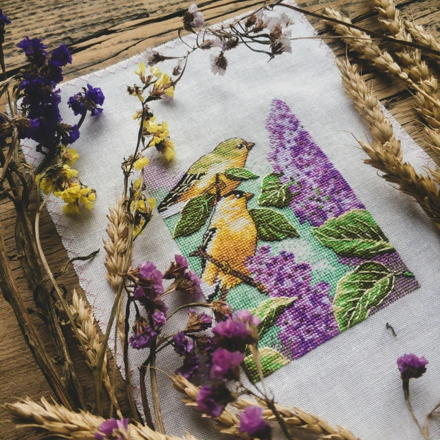 a piece of fabric with flowers placed on it