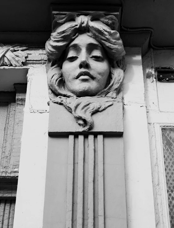 a building with columns and a sculpture above