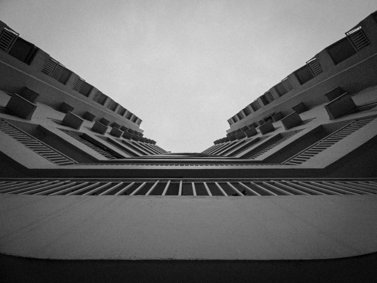 the bottom half of some buildings in a black and white po