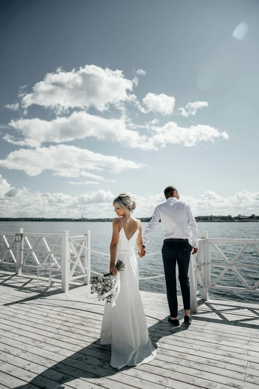 a newly married couple on the dock