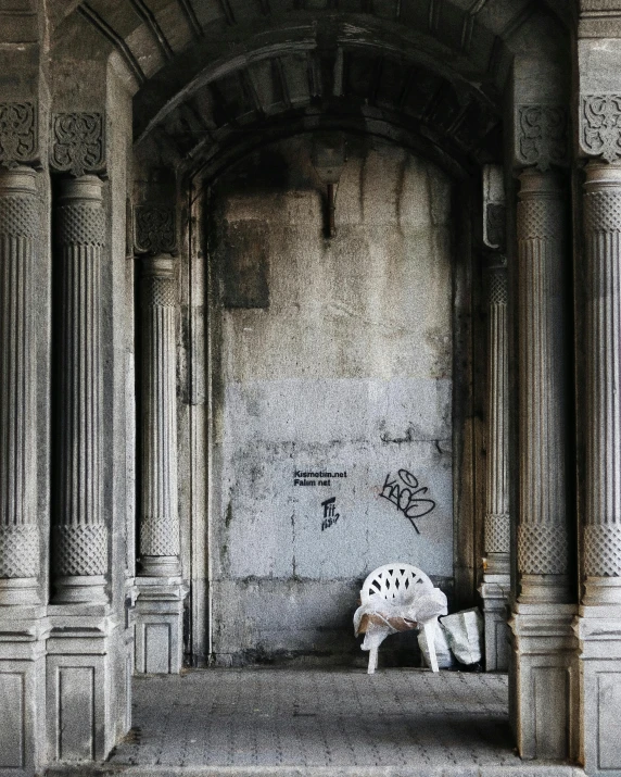 a sculpture sits next to the entrance to a building