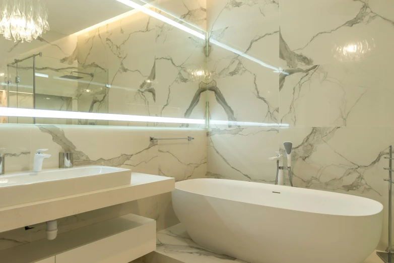 a large marble bathroom has a round tub