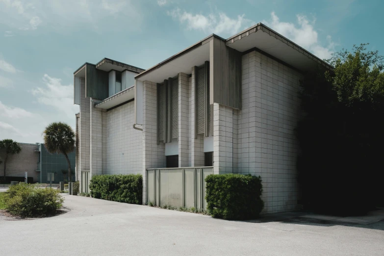 two modern houses in the middle of an empty lot