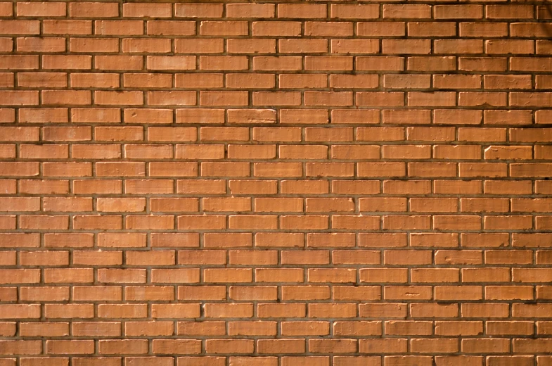 a street scene with focus on a brick wall