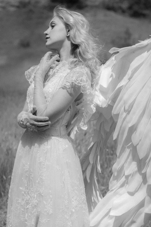 a black and white po of an angel in full attire