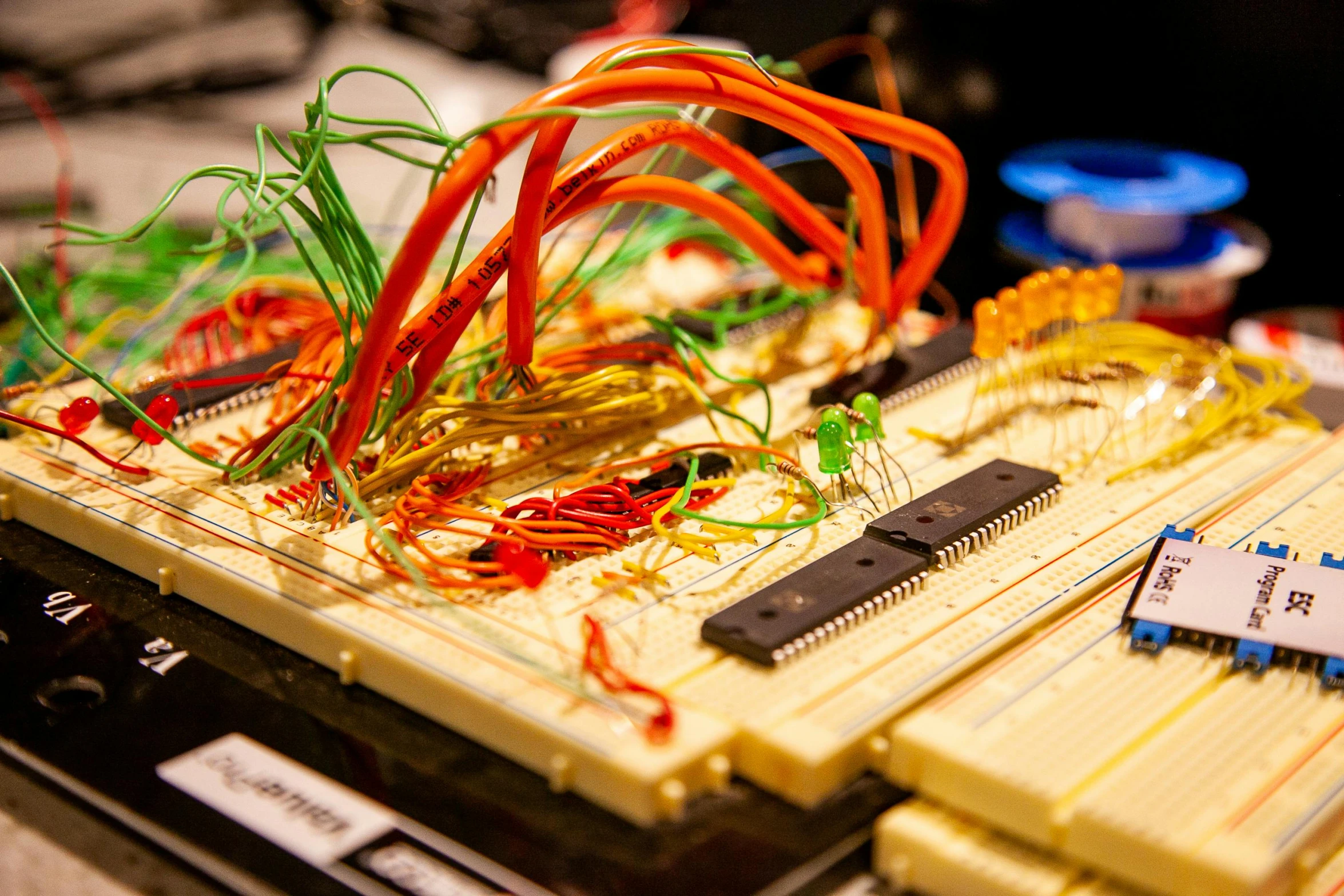 a wooden board with many wire and small components