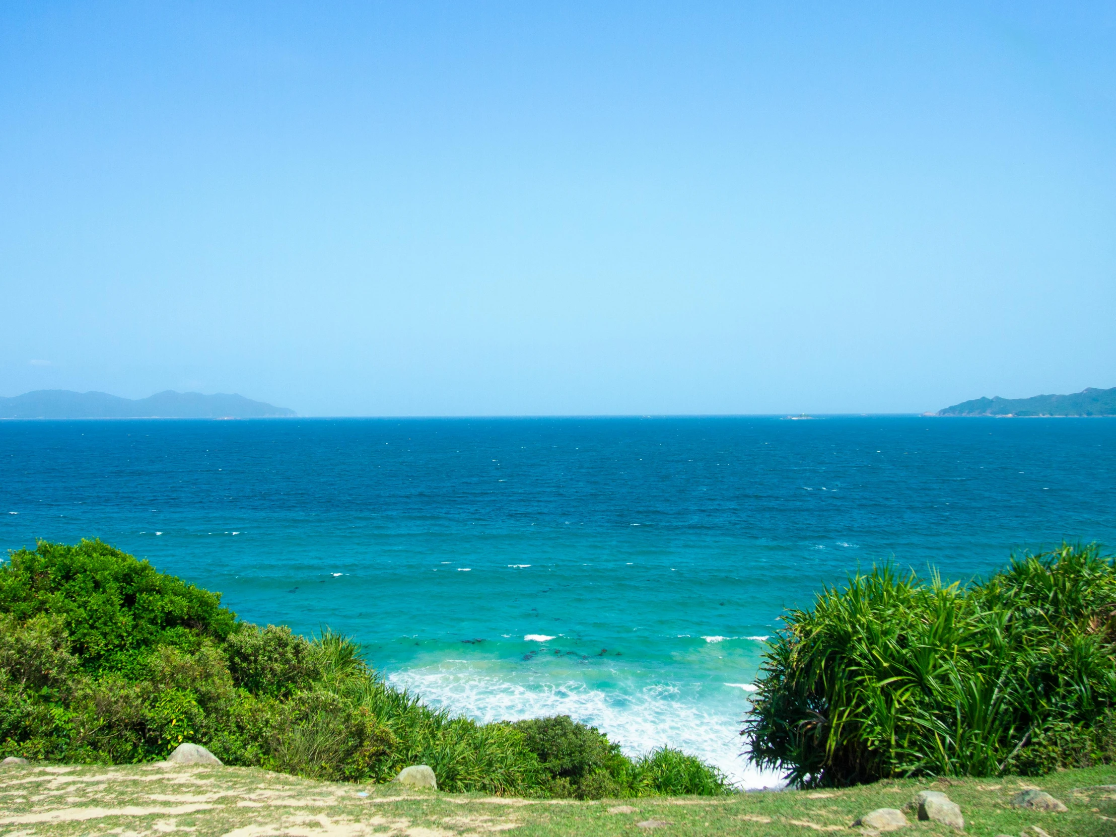 an ocean view from a hill overlooking the ocean