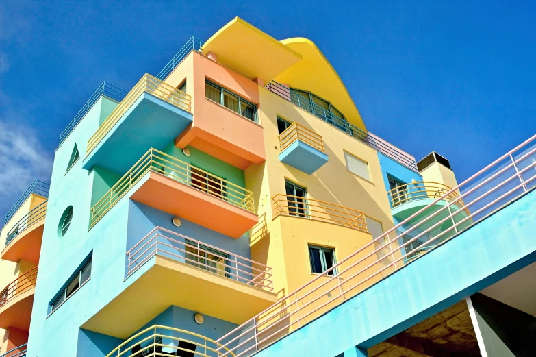 there are many balconies on the multi colored building