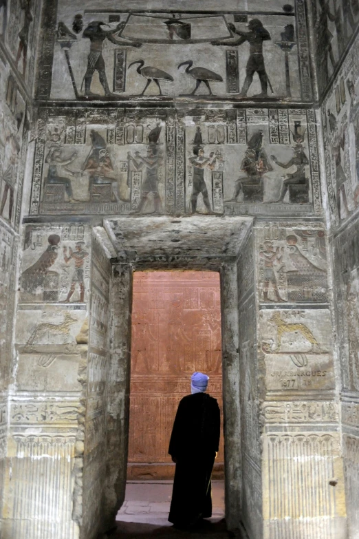 a person that is standing in front of a doorway