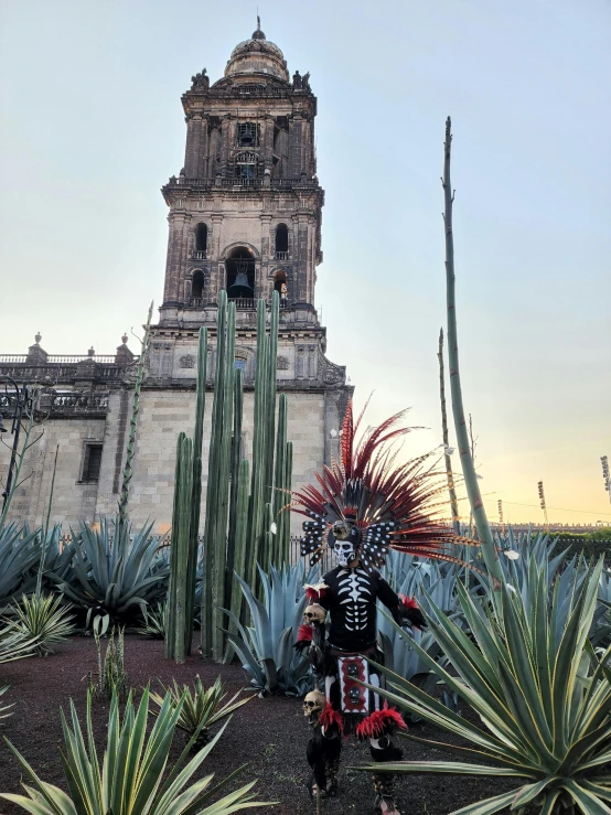 a clock tower with an iron skeleton decoration in the middle